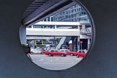 Hong kong street through the frame. blurred in motion car on urban road. asian city transportation