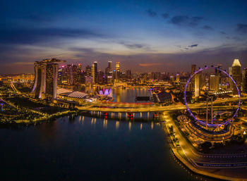 Illuminated buildings in city at night