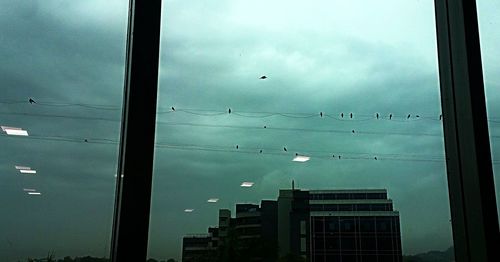 Low angle view of building against cloudy sky