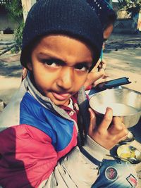 Portrait of cute boy holding ice cream