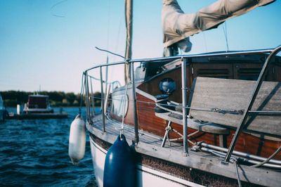 Cropped image of boat on sea against sky