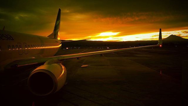 sunset, orange color, transportation, sky, mode of transport, cloud - sky, sunlight, no people, sun, outdoors, airplane, nature, close-up, beauty in nature, yellow, air vehicle, metal, cloud, cropped, scenics