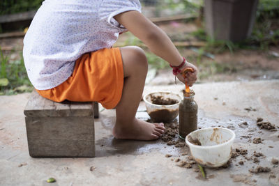 Low section of woman preparing food