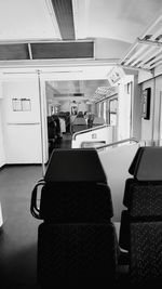 Rear view of people sitting in train