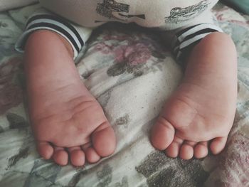 Low section of baby feet