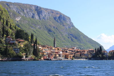 Scenic view of sea and mountains against sky