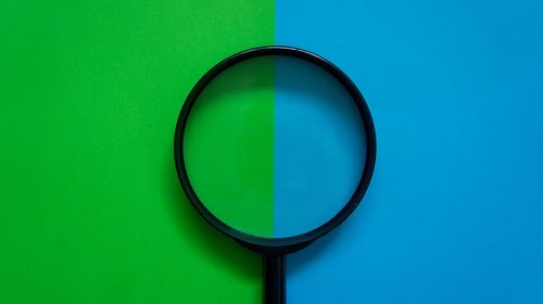 Close-up of glass against blue background