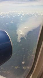 View of landscape seen through airplane window