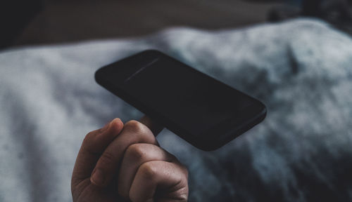 Close-up of hand holding smart phone