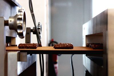 Chocolates on conveyor belt in factory