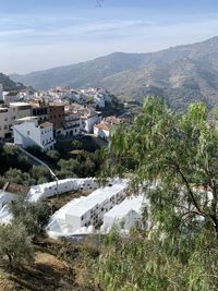 High angle view of sayalonga and its circular cemetery against sky in southern spain.