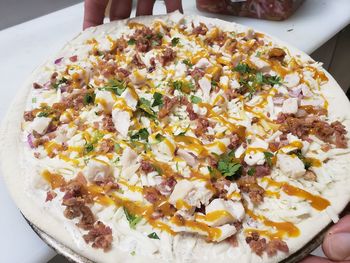 High angle view of pizza served on table