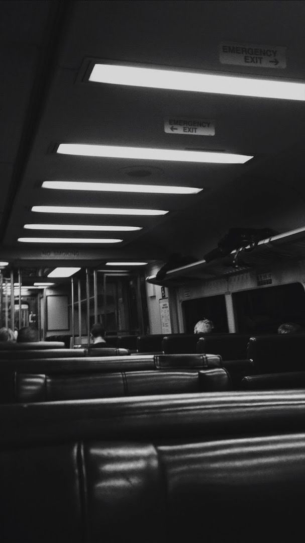 transportation, public transportation, indoors, illuminated, mode of transportation, architecture, rail transportation, lighting equipment, one person, real people, travel, land vehicle, subway station, train, incidental people, built structure, lifestyles, motion, subway, ceiling, architectural column, subway train