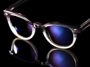 Close-up of sunglasses over black background