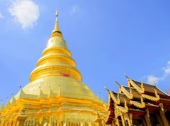 Low angle view of wat phra that doi suthep against sky