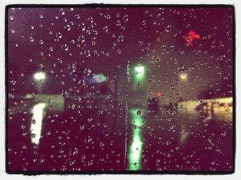 Full frame shot of raindrops on glass