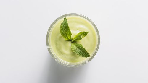 Close-up of drink against white background