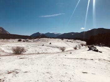 Scenic view of snowcapped mountains against sky