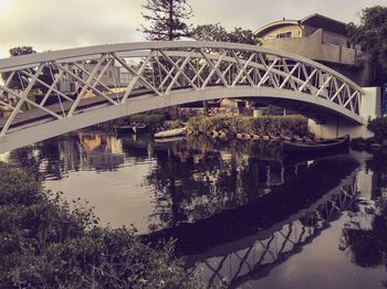 Bridge over river against sky