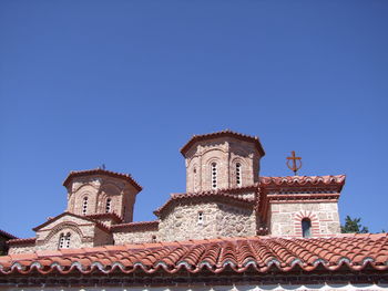 Low angle view of temple against clear blue sky