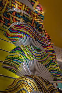 Low angle view of colorful hand fans in store for sale