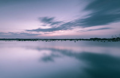 Scenic view of sea against sky at sunset