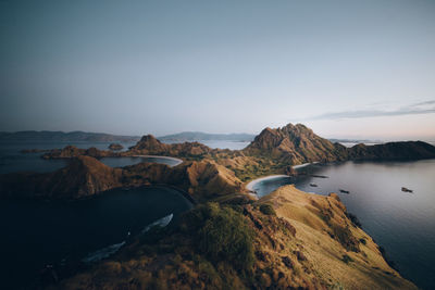 High angle view of lake and mountains against sky