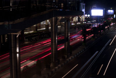 Blurred motion of railroad tracks in city at night