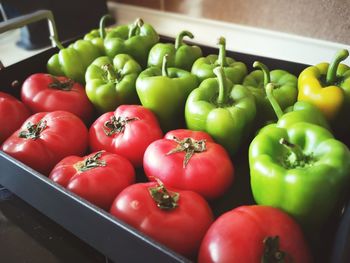 Close-up of red bell peppers in container