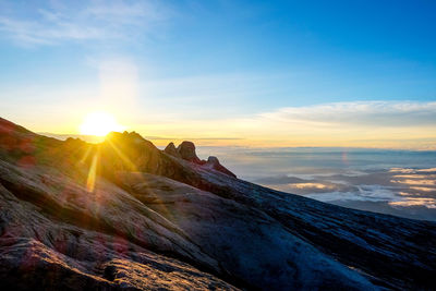 Scenic view of mountains against sky during sunset