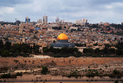 Buildings in city against sky