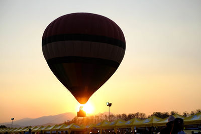 Low angle view of hot air balloon against sky during sunset