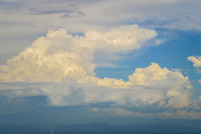 Clouds of white-gray color against a blue sky after a thunderstorm.