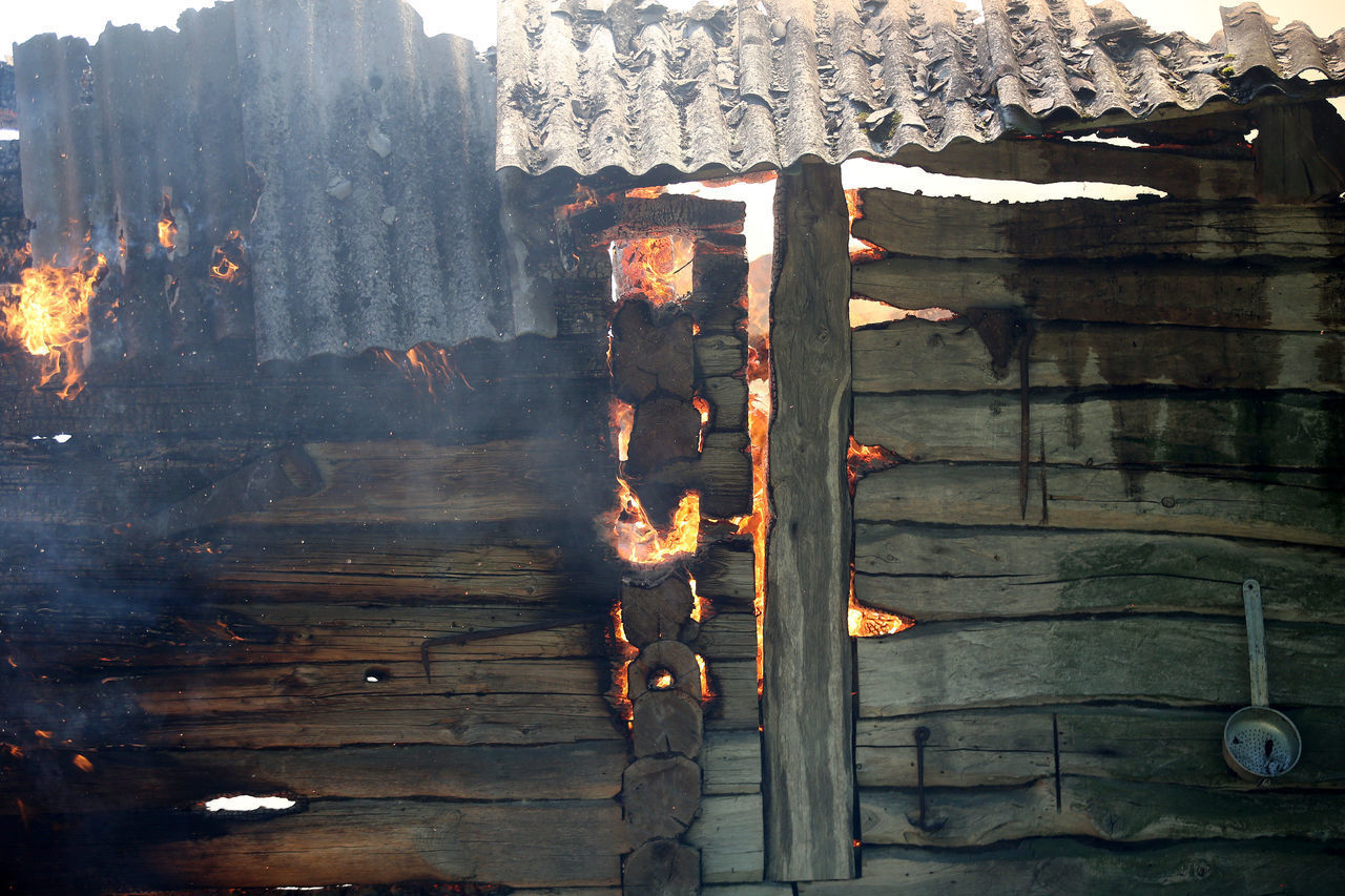 CLOSE-UP OF FIRE ON WOODEN STRUCTURE