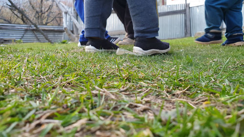 Low section of people walking on land