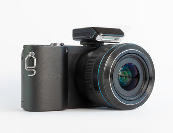 Close-up of camera against white background