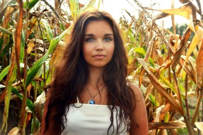 Portrait of young woman in field