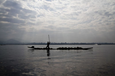Scenic view of sea against cloudy sky