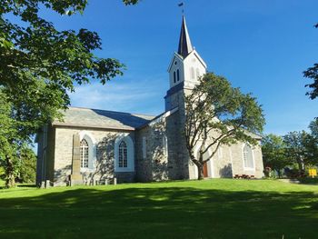 Low angle view of church against blue sky