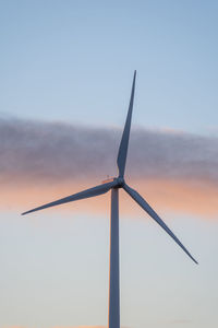 Low angle view of wind turbine against sky