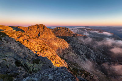 Scenic view of mountains against sky during sunset