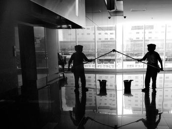 Man cleaning wall