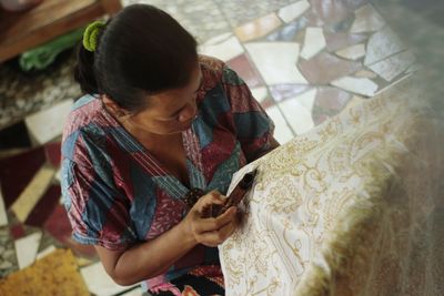 High angle view of woman using mobile phone