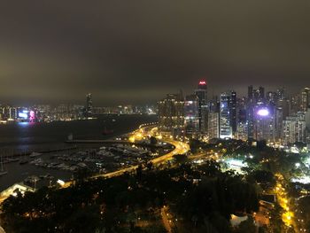 High angle view of illuminated buildings in city at night