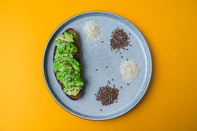 Ingredients for healthy avocado toast. sesame flax seeds. vegan keto diet. 