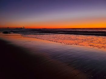 Scenic view of beach against sky during sunset