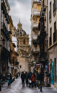 People walking on street in city