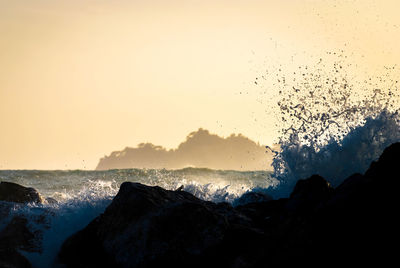 Scenic view of sea against sky at sunset