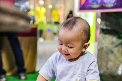 Close-up of cute smiling boy in store 