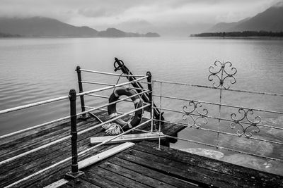 View of pier on lake against sky